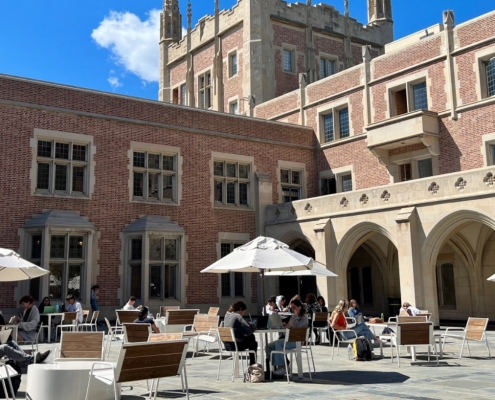 students sitting outside of ucla kerckhoff hall