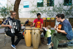 3 guys playing music outside