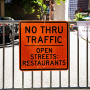No thru traffic orange sign
