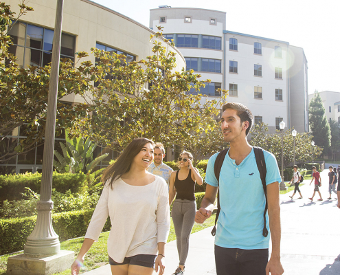 ucla students walking next to De Neve Plaza