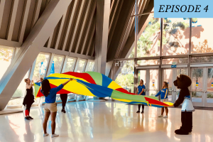 bruinbear and some students play with rainbow parachute