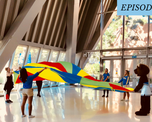 bruinbear and some students play with rainbow parachute