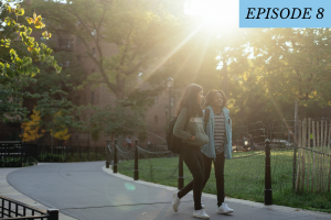 2 students walking on campus