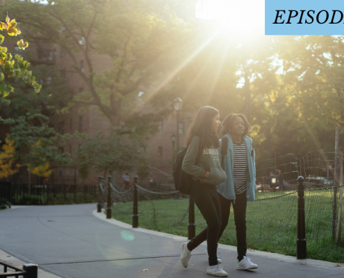 2 students walking on campus