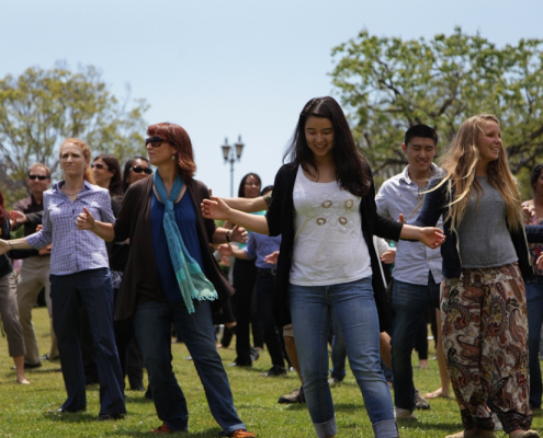 Group of people dancing outside on the courtyard