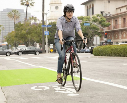 a woman riding a bike in westwood