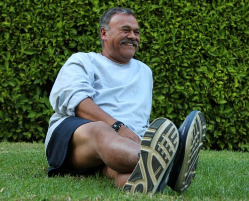 Frank Lopez sitting on grass