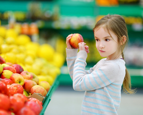 Girl holding an apple