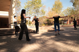 People hula hooping on campus