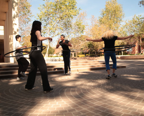 People hula hooping on campus