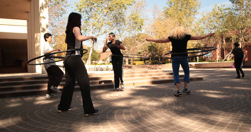 People hula hooping on campus