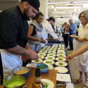 Chef serving food to some customers at an event