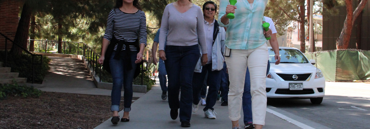 A group of women walking on UCLA campus