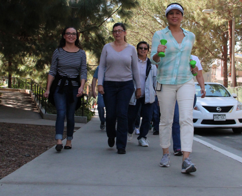 A group of women walking on UCLA campus