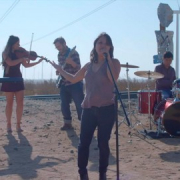 students performing in the middle of no where in the desert