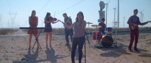 students performing in the middle of no where in the desert