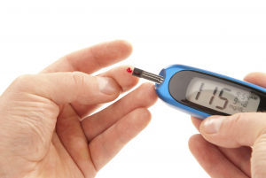 a person taking a diabetes blood test