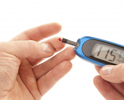 a person taking a diabetes blood test