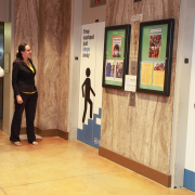 A man and a woman standing in front of the elevators