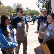 a woman talking to her group of students