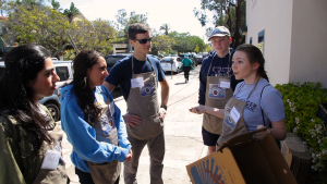 a woman talking to her group of students