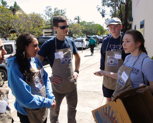 a woman talking to her group of students