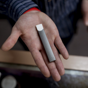 Person holding a Juul Vape