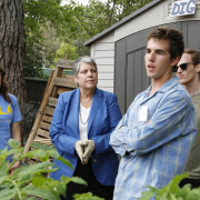 Janet Napolitano with some students in the garden