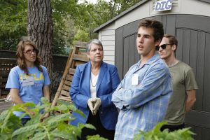 Janet Napolitano with some students in the garden