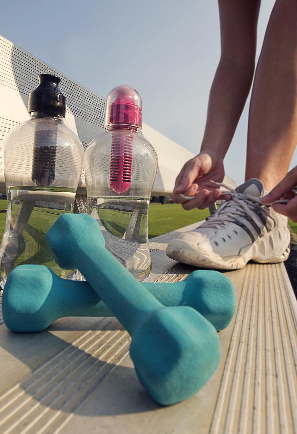 15318-a-healthy-young-woman-tying-her-laces-before-exercise-pv.jpg