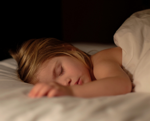 girl sleep in her bed