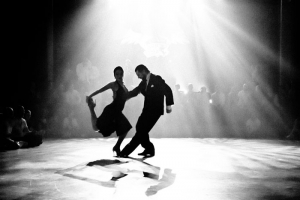 man and woman dancing on the dance floor