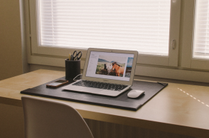 open laptop sitting on top of a table